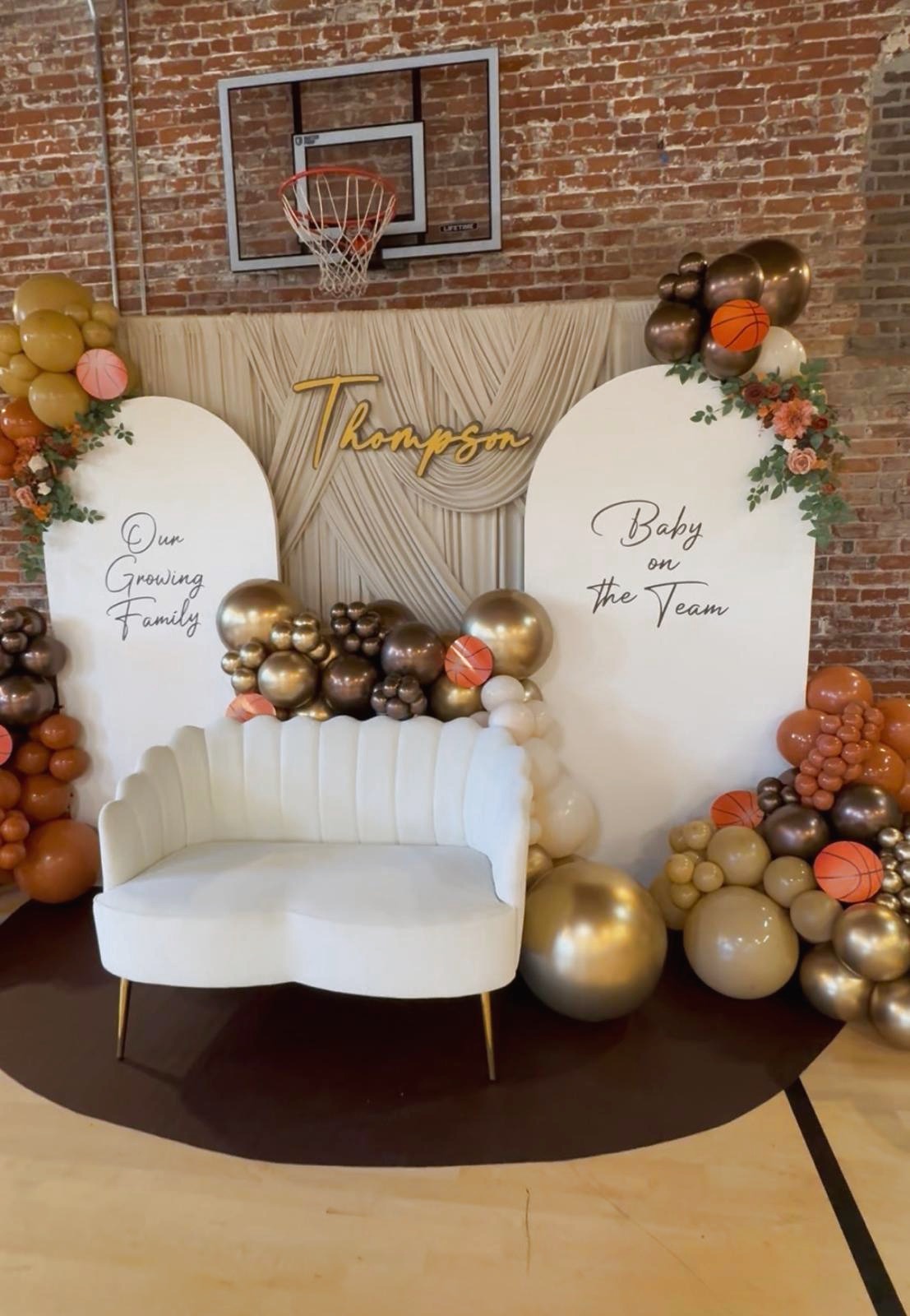 Thompson Dreamscape backdrop with neutral balloons and draping